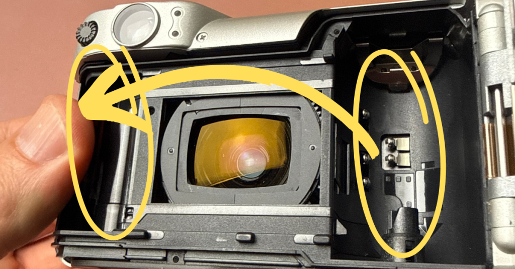 how to put film in a canon sure shot z155 camera